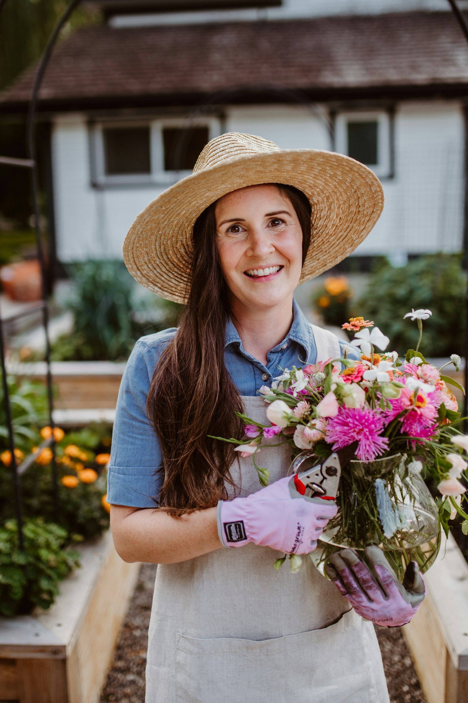 Florist arranging a fresh seasonal bouquet at The Flower Boutique