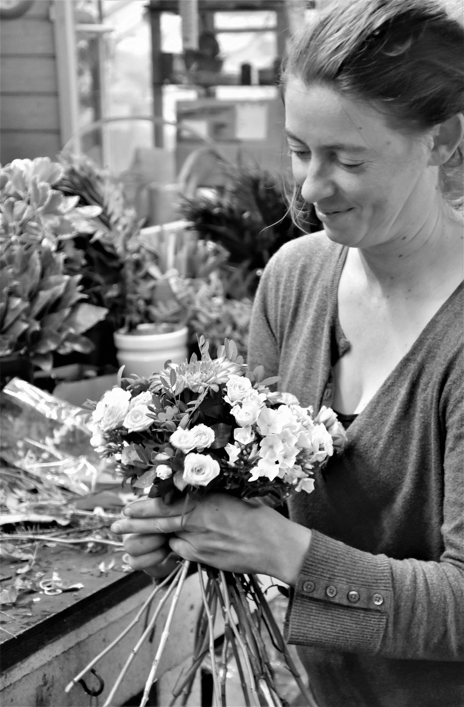 Our founding florist arranging flowers by hand