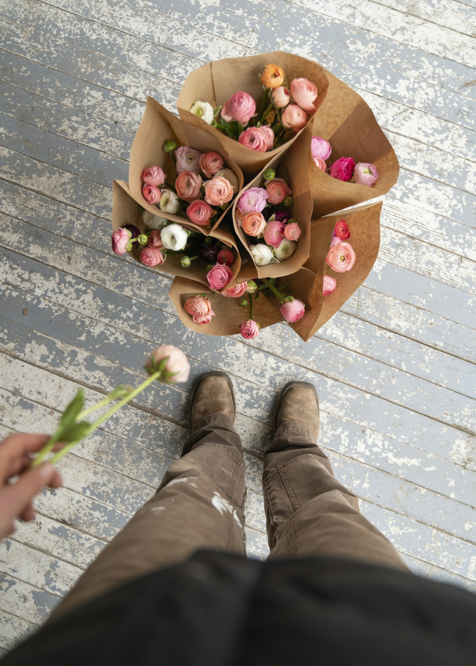 Fresh ranunculus bouquets wrapped in kraft paper